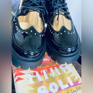 Rieker Black and Gold Lace Up platforms